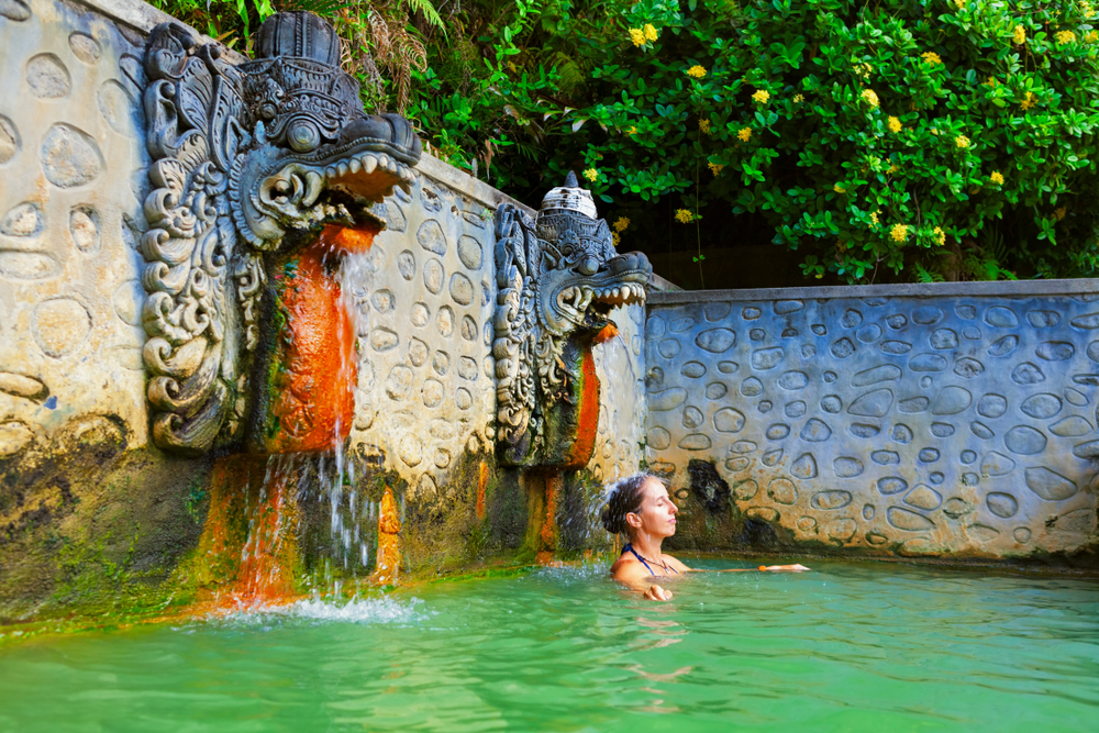 Young,Woman,Stand,In,Thermal,Bath,,Relaxing,Under,Flowing,Water